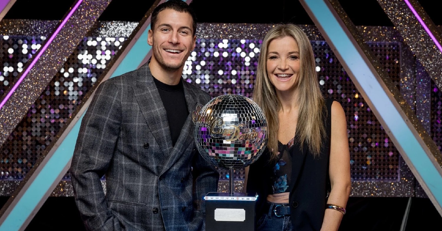 Gorka and Helen posting next to the Strictly Glitterball trophy
