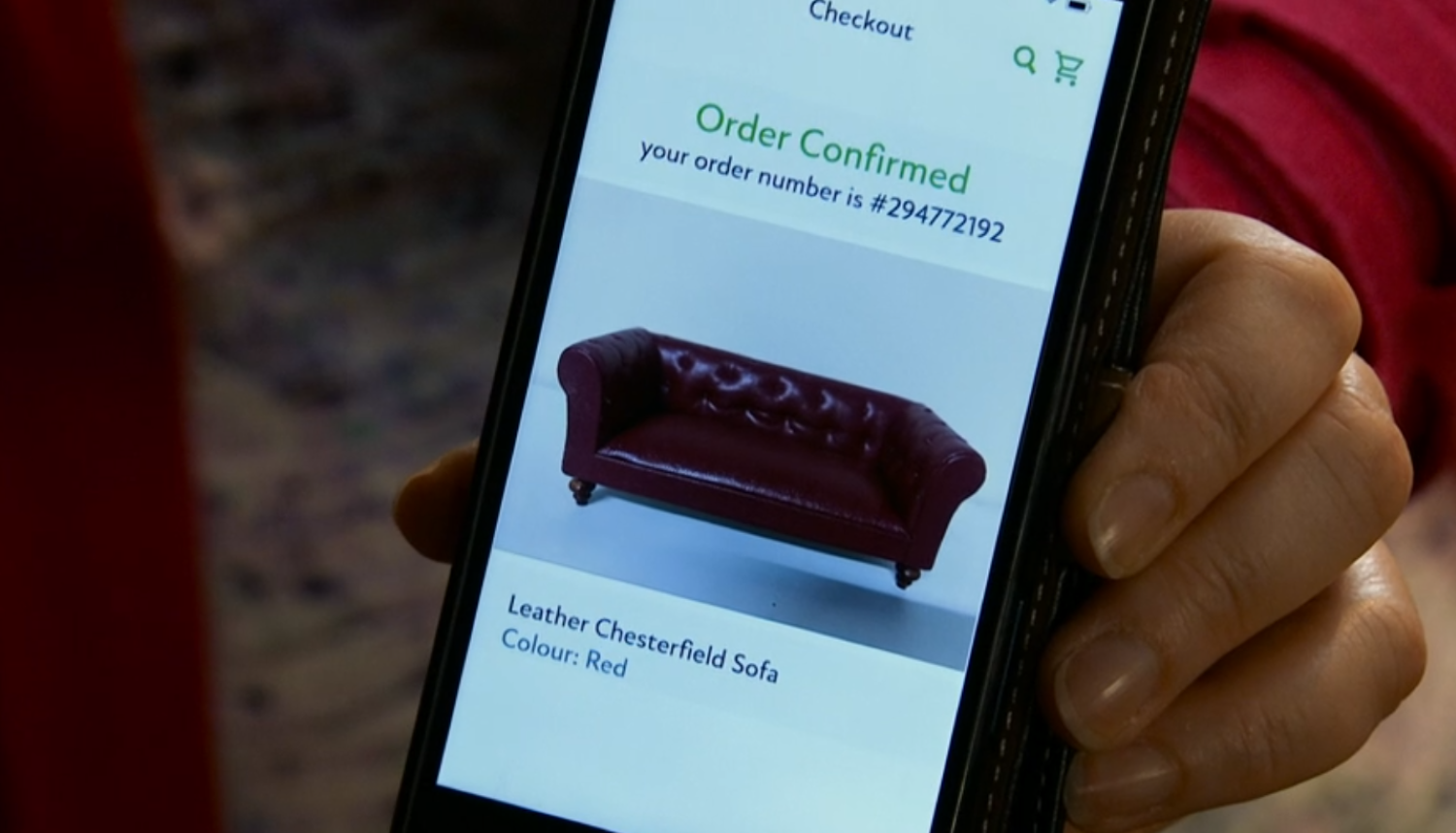Red Leather Chesterfield sofa on a phone in Coronation Street 