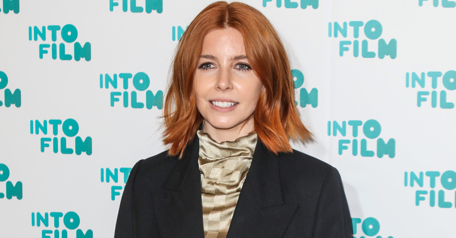 Stacey Dooley smiles to the camera