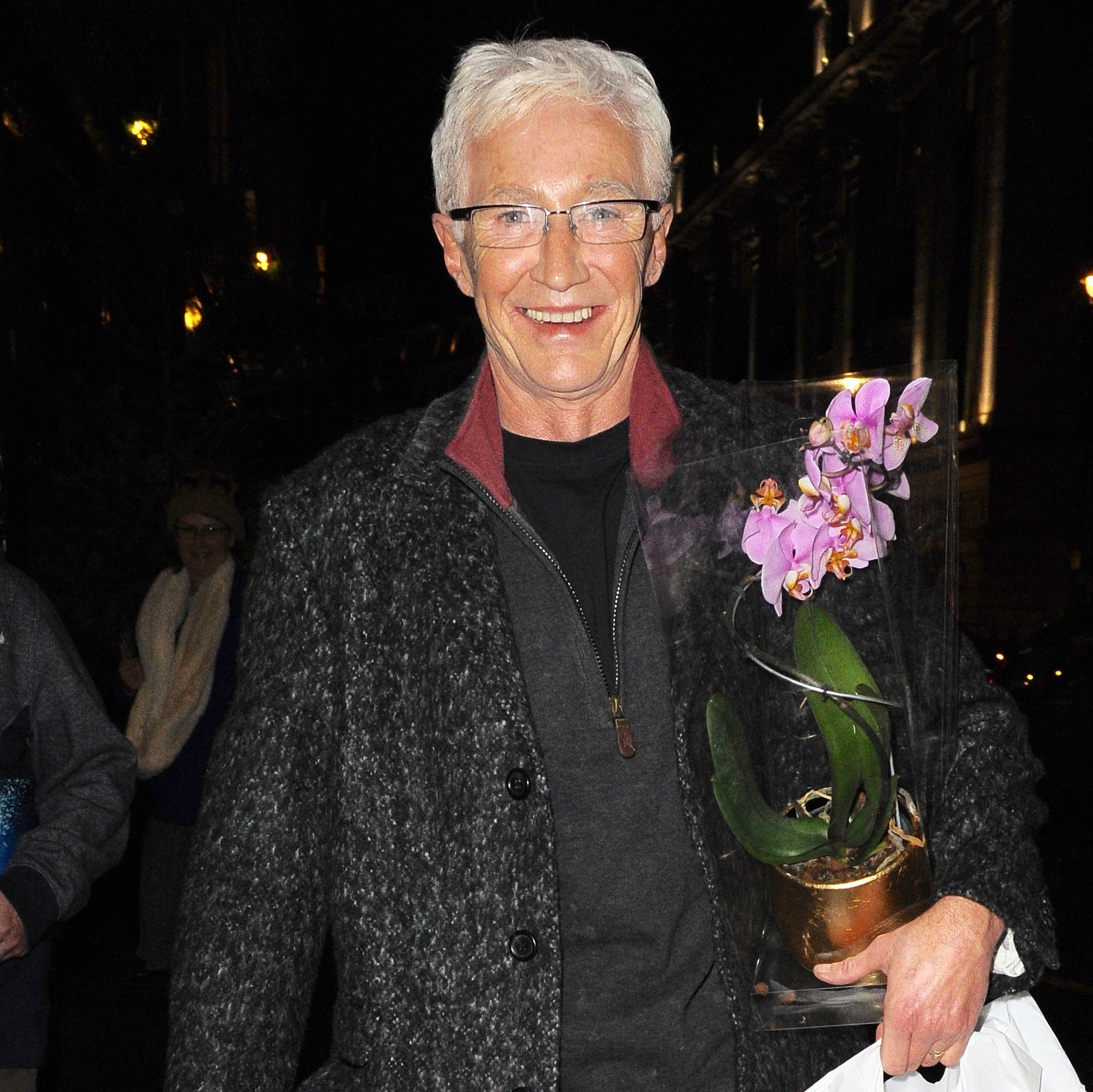 Paul O'Grady with a flower in his arm