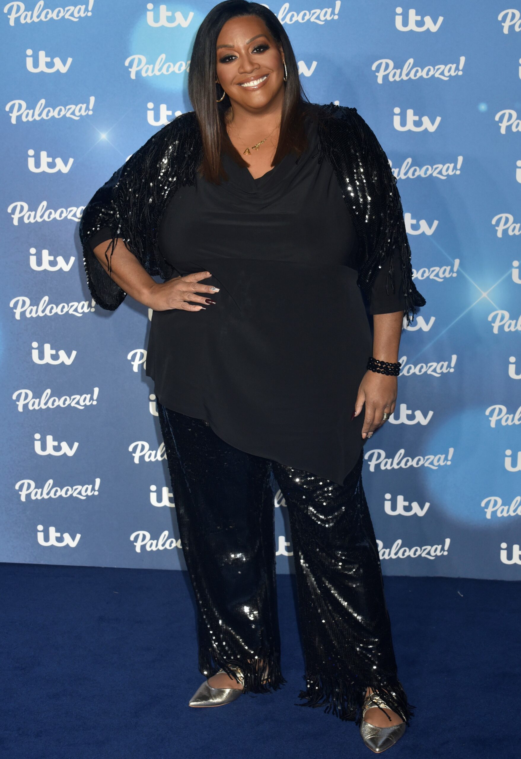 Alison Hammond smiling on blue carpet at ITV Palooza