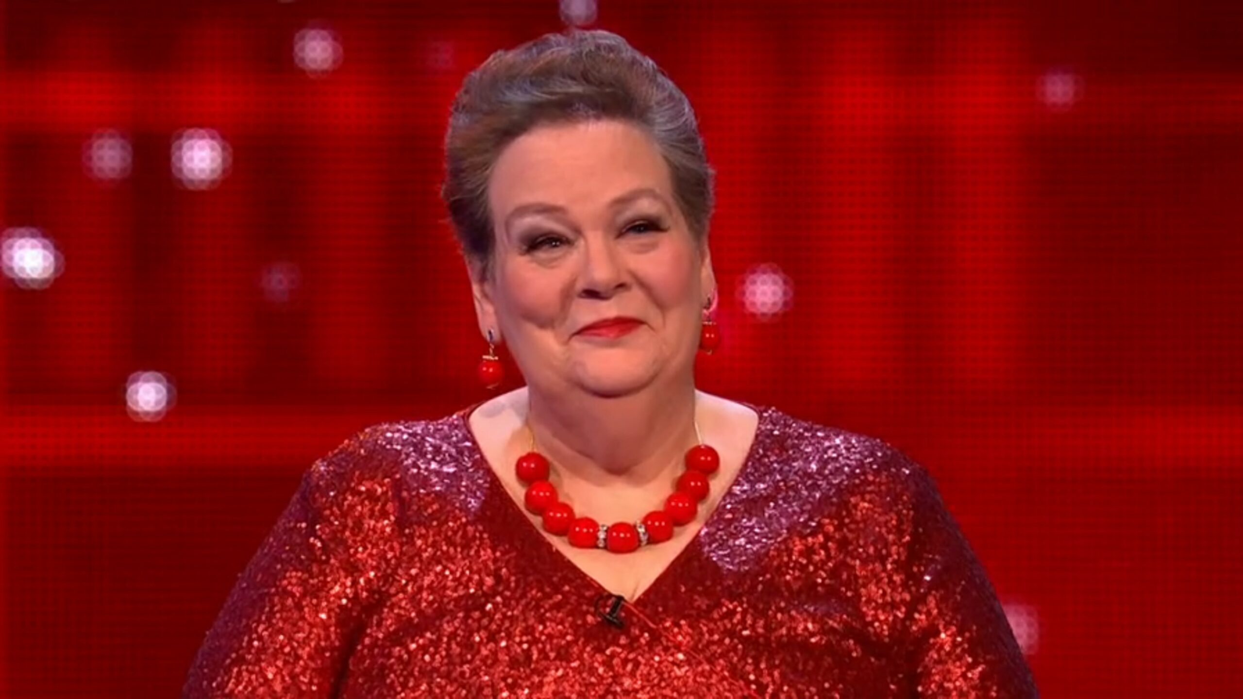 Anne Hegerty in red dress on The Chase