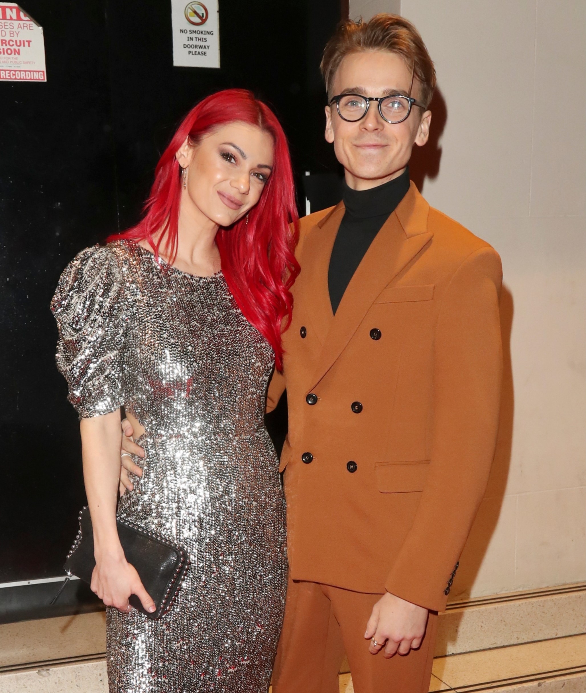 Dianne Buswell and Joe Sugg smiling at event