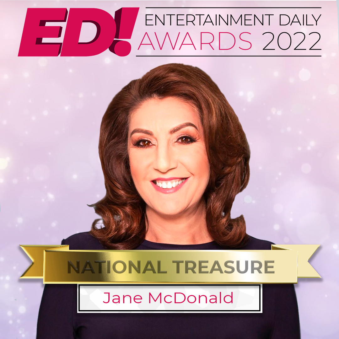 Jane McDonald smiling against a pink background