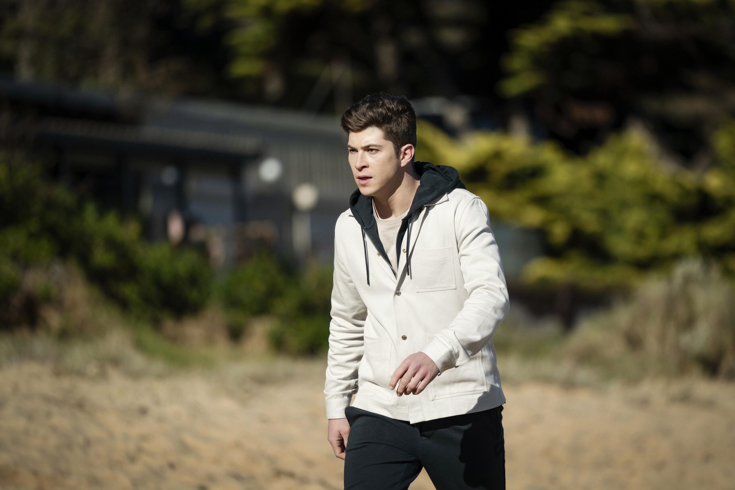 Ethan walks up to Sean on the beach in Riptide