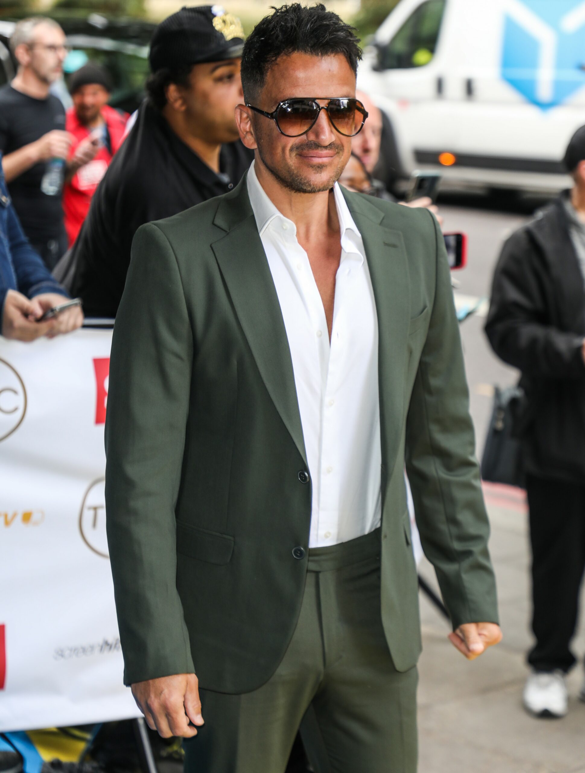 Peter Andre smiling with sunglasses on at TRIC Awards