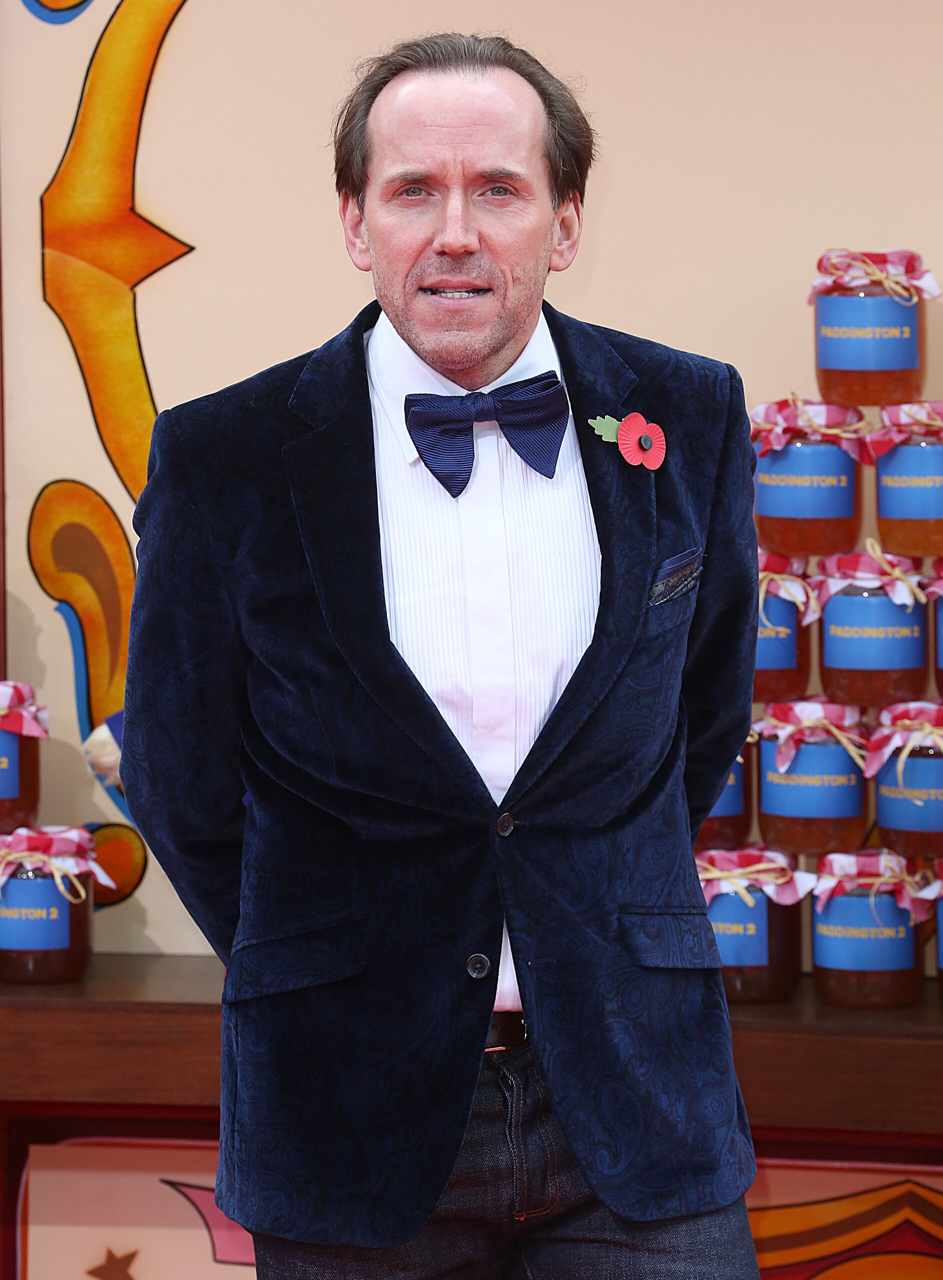 Ben Miller wearing a suit at a red carpet event