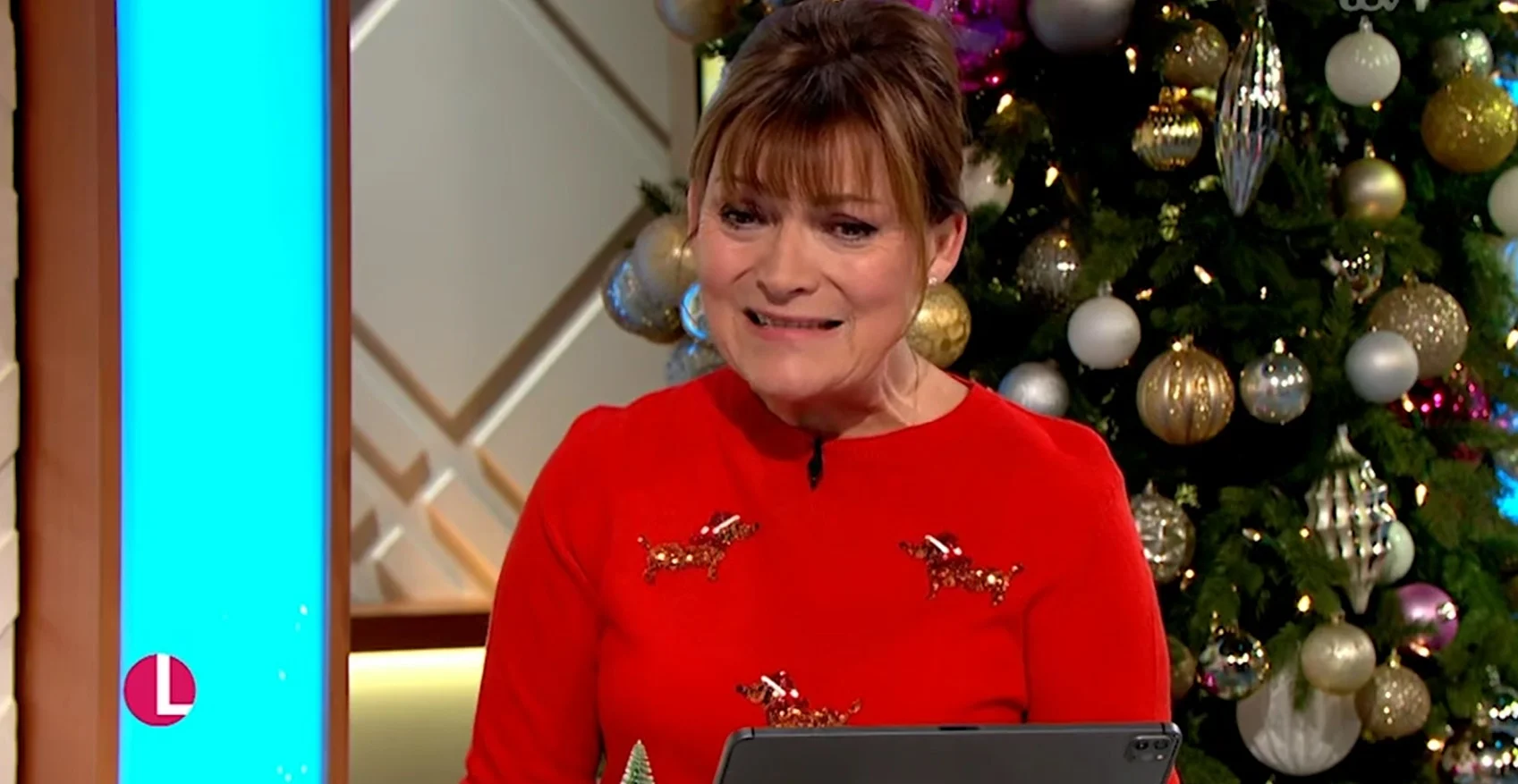 Lorraine Kelly wincing while wearing red on Lorraine 