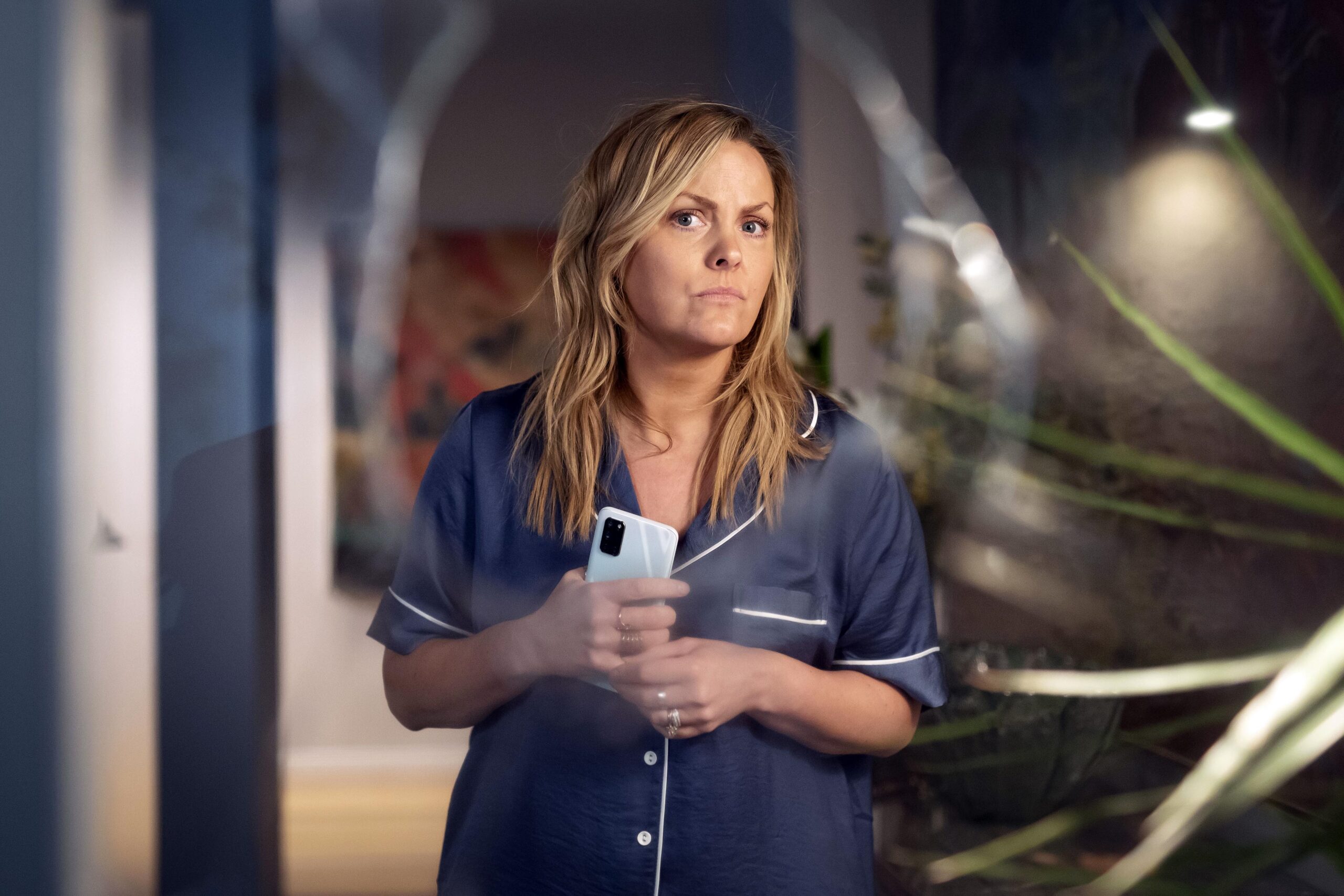 Alison looks through broken glass in Riptide episode 2