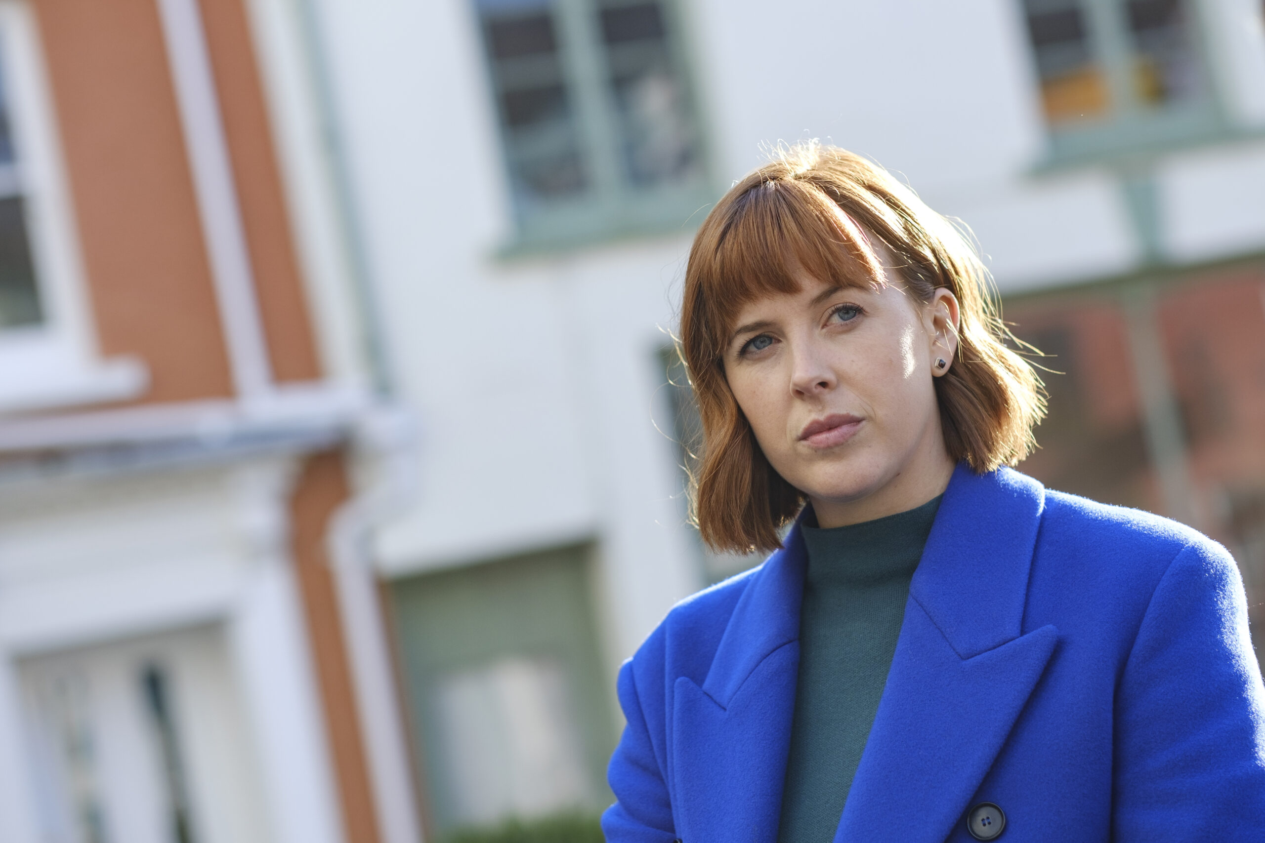 Cat looks up in the street in The Light In The Hall