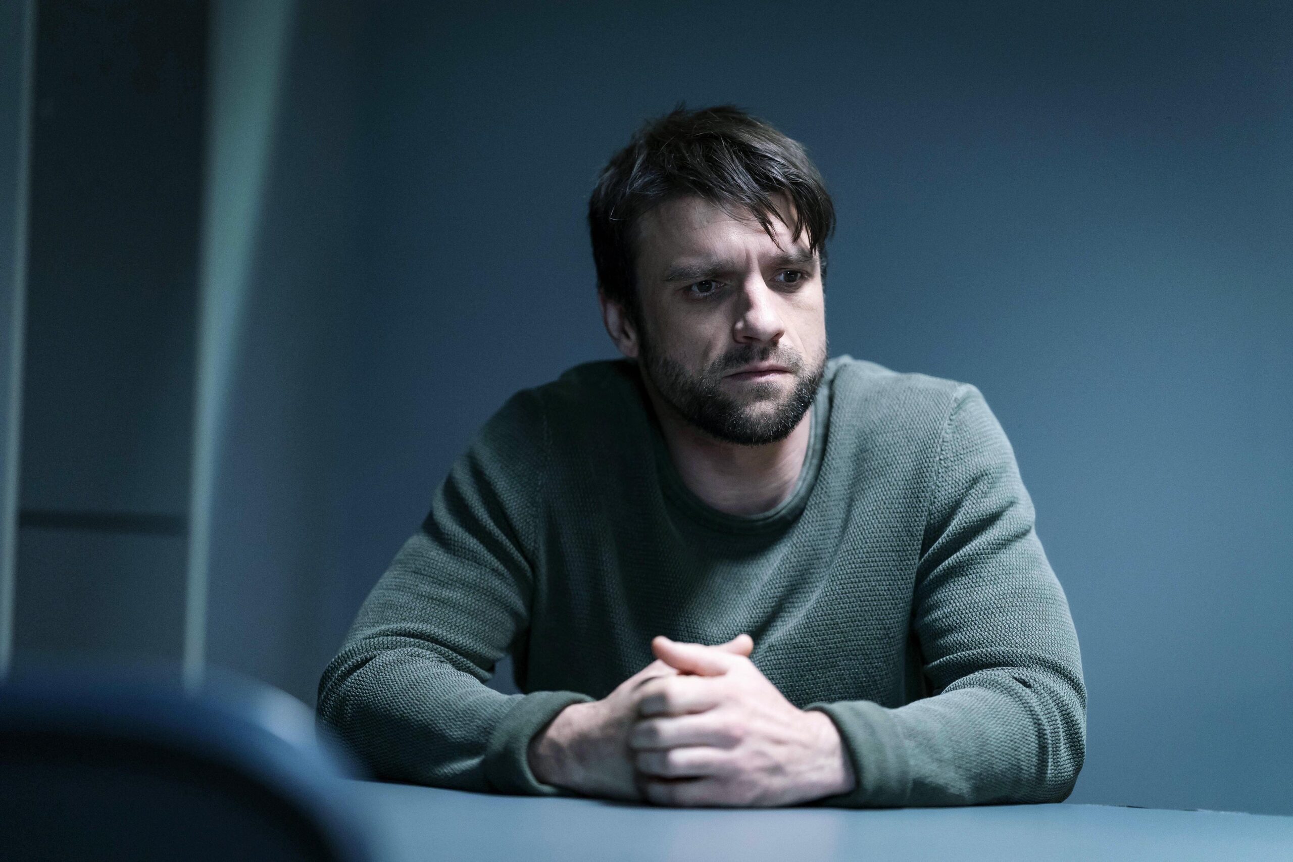 Michael sits in a police room in Riptide