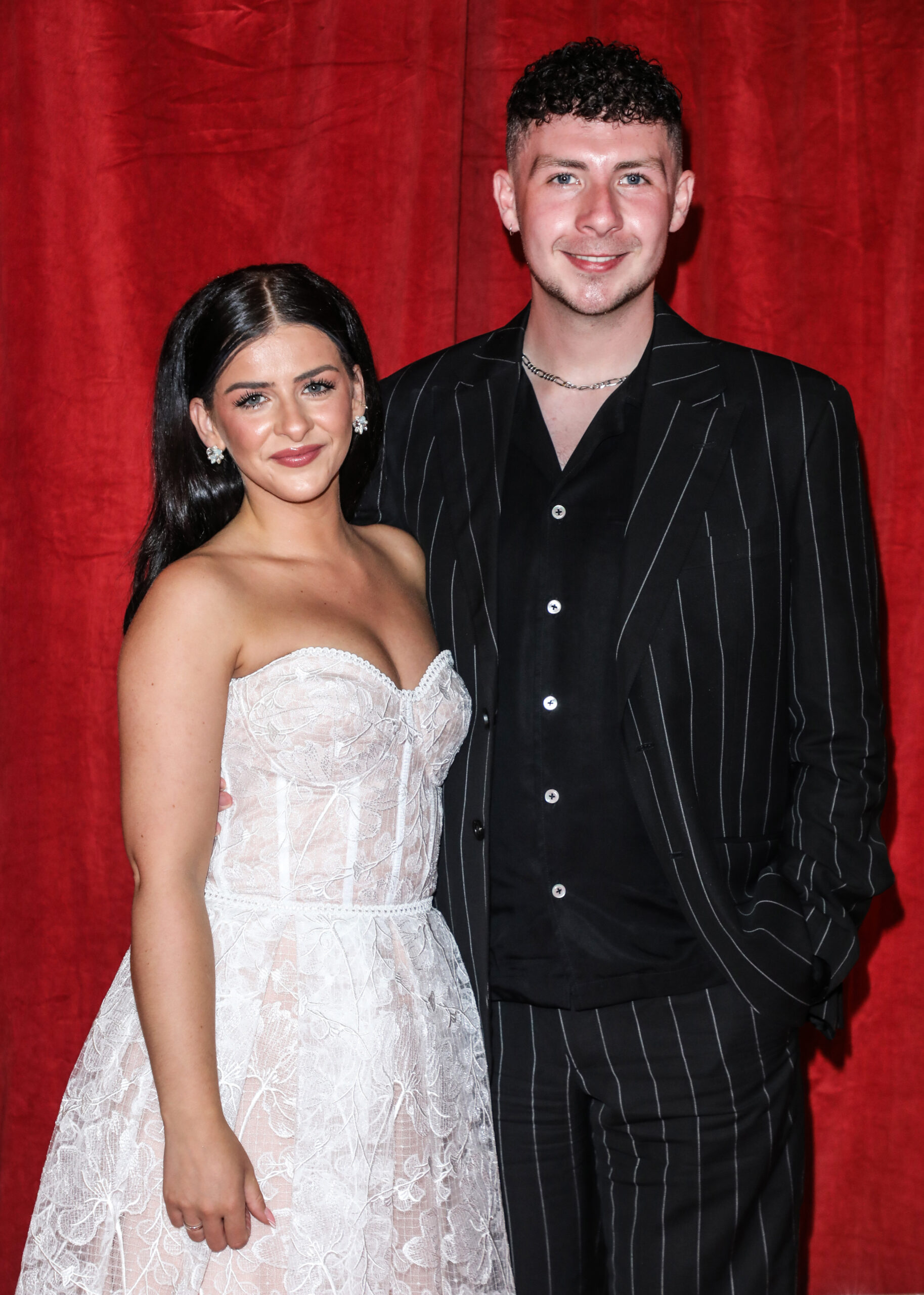 Rebecca Ryan and her husband on the red carpet
