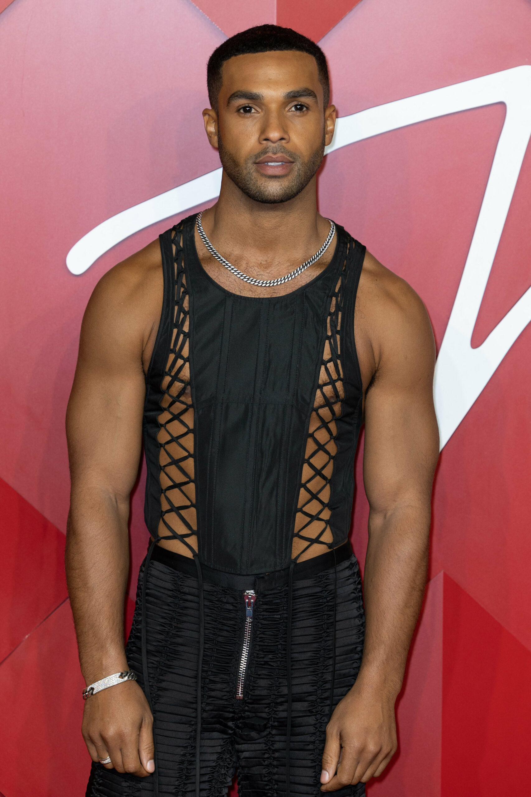 Former Coronation Street star Lucien Laviscount in a black netted vest