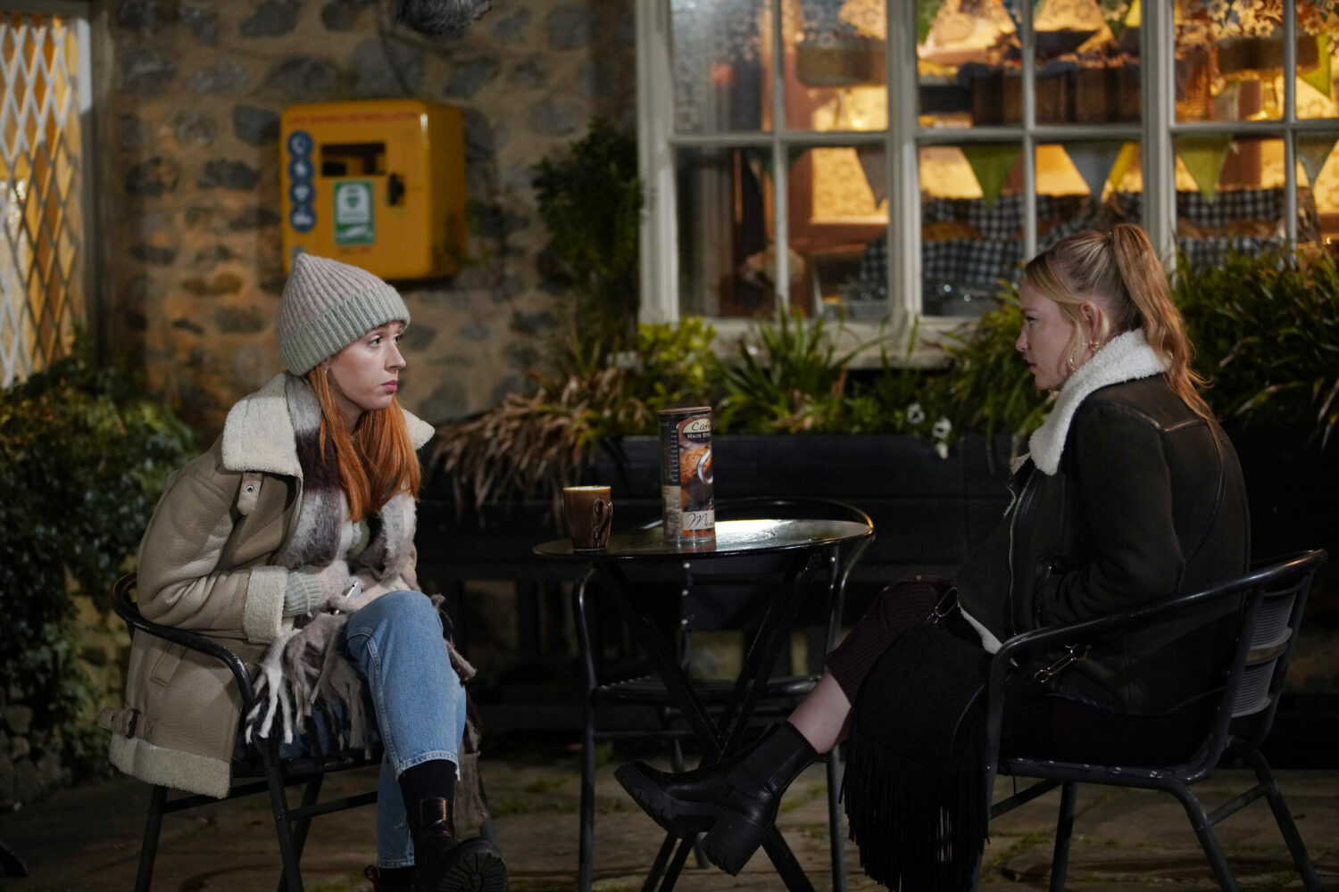 Chloe Harris and Amy Wyatt look serious as they discuss being sisters