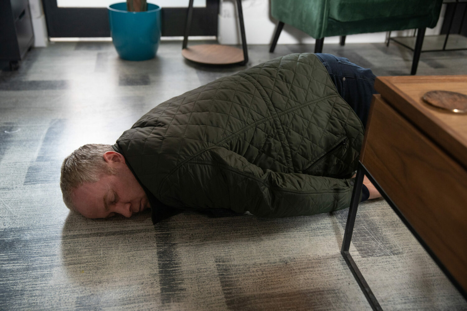 Teddy lies on the floor, dead, on Coronation Street