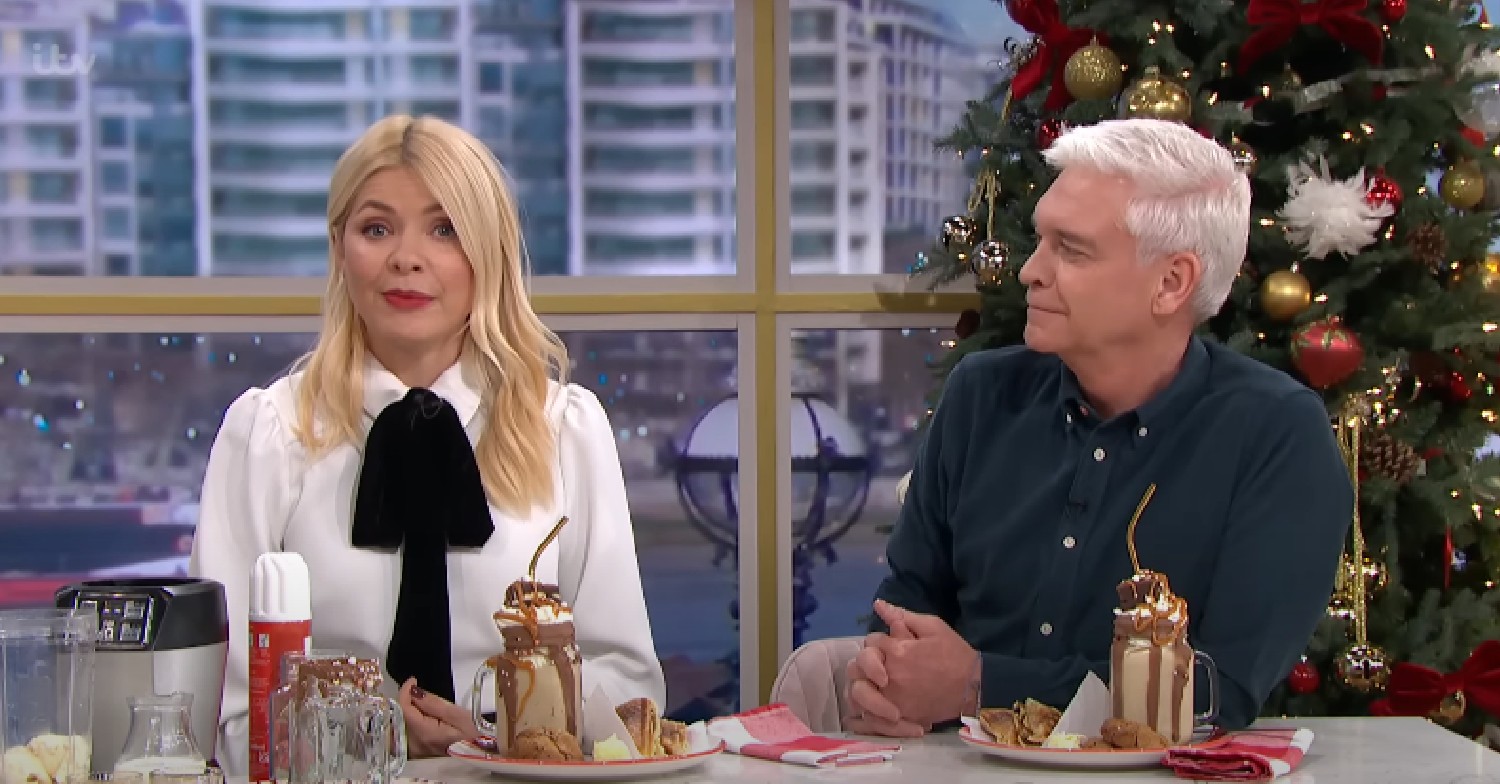 Phillip Schofield looking at Holly Willoughby as she speaks on This Morning