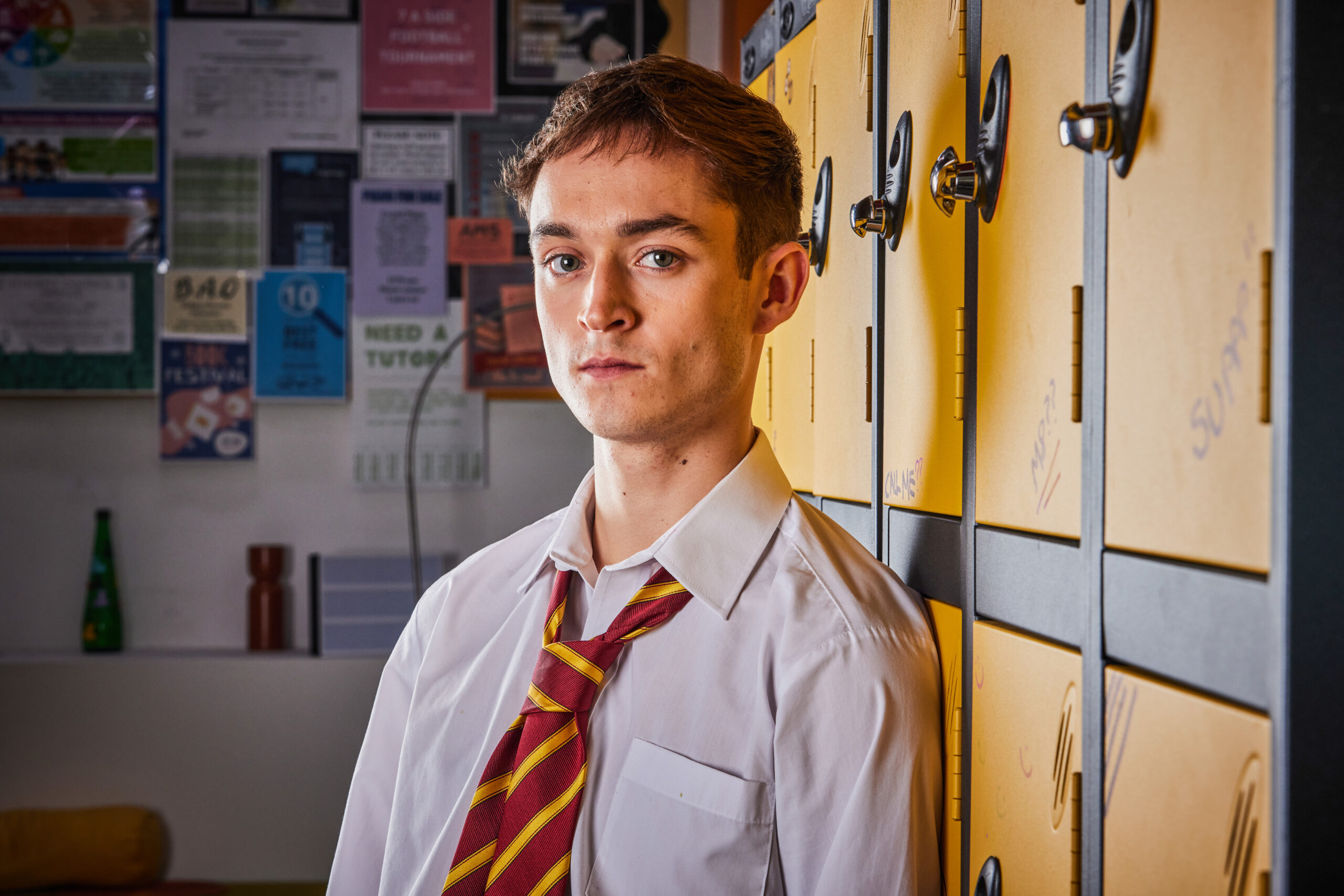 Dean Weaver frowns in Waterloo Road uniform