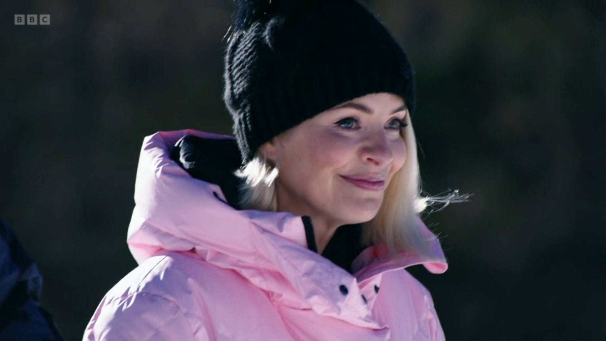 Holly Willoughby smiling in pink coat