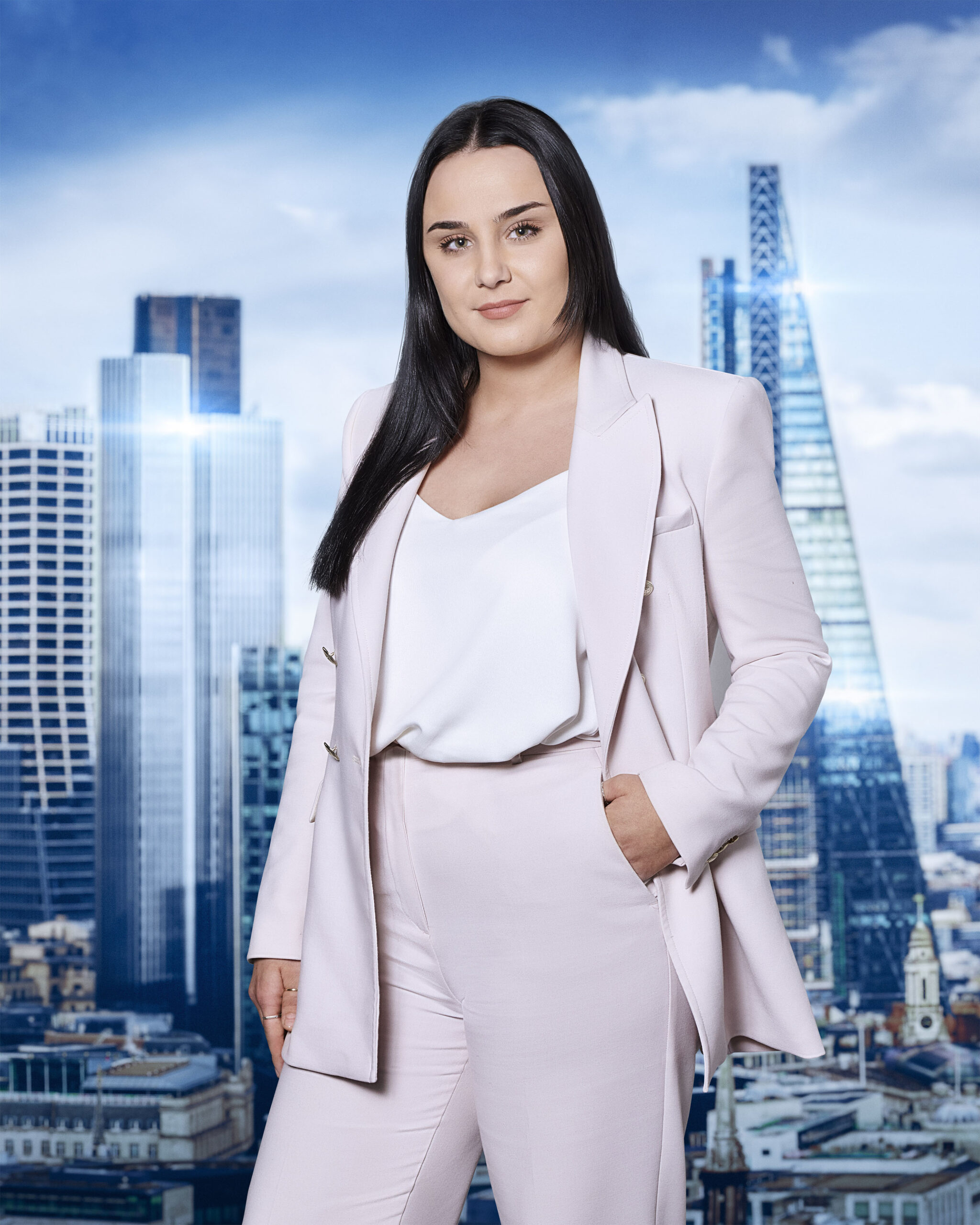 Megan Hornby poses in a pink suit on The Apprentice