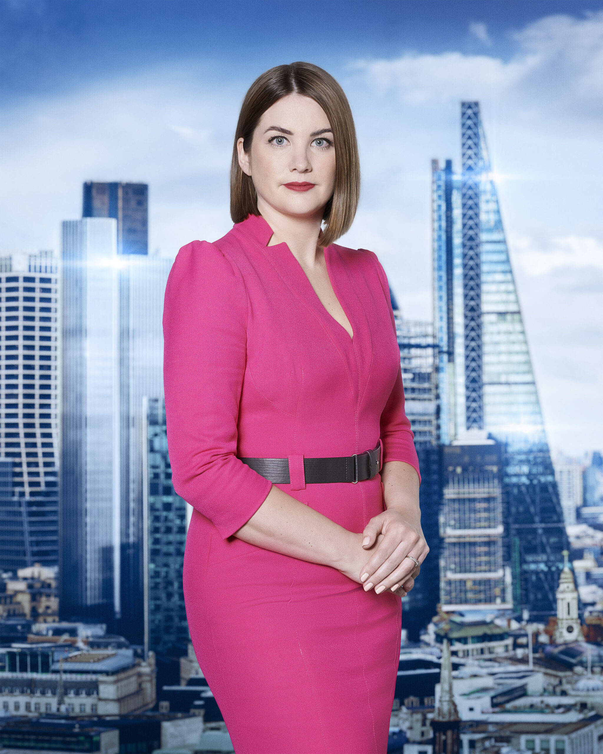 Shannon Martin poses in a bright pink dress on The Apprentice 2023