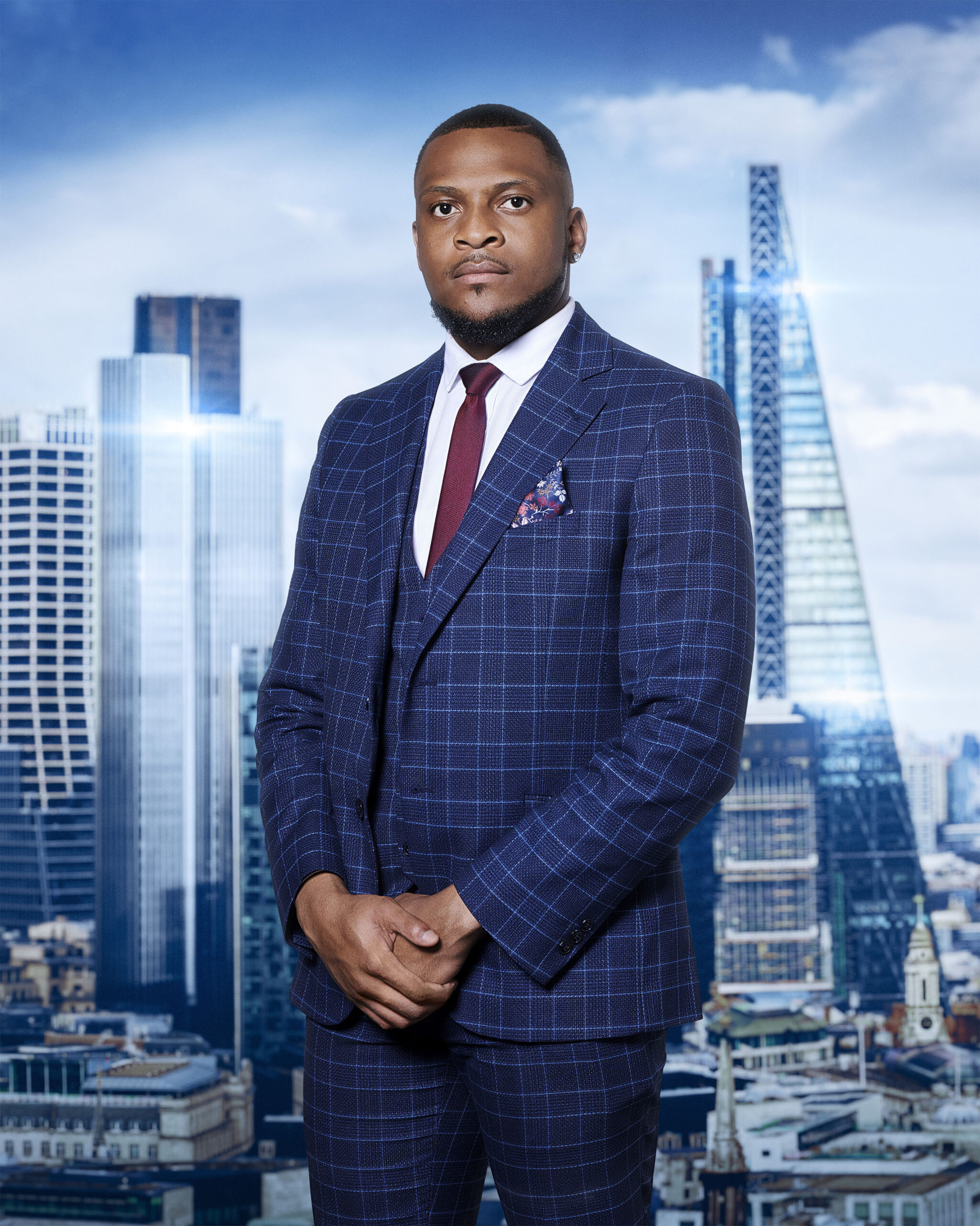 Simba Rwambiwa poses in blue suit for The Apprentice