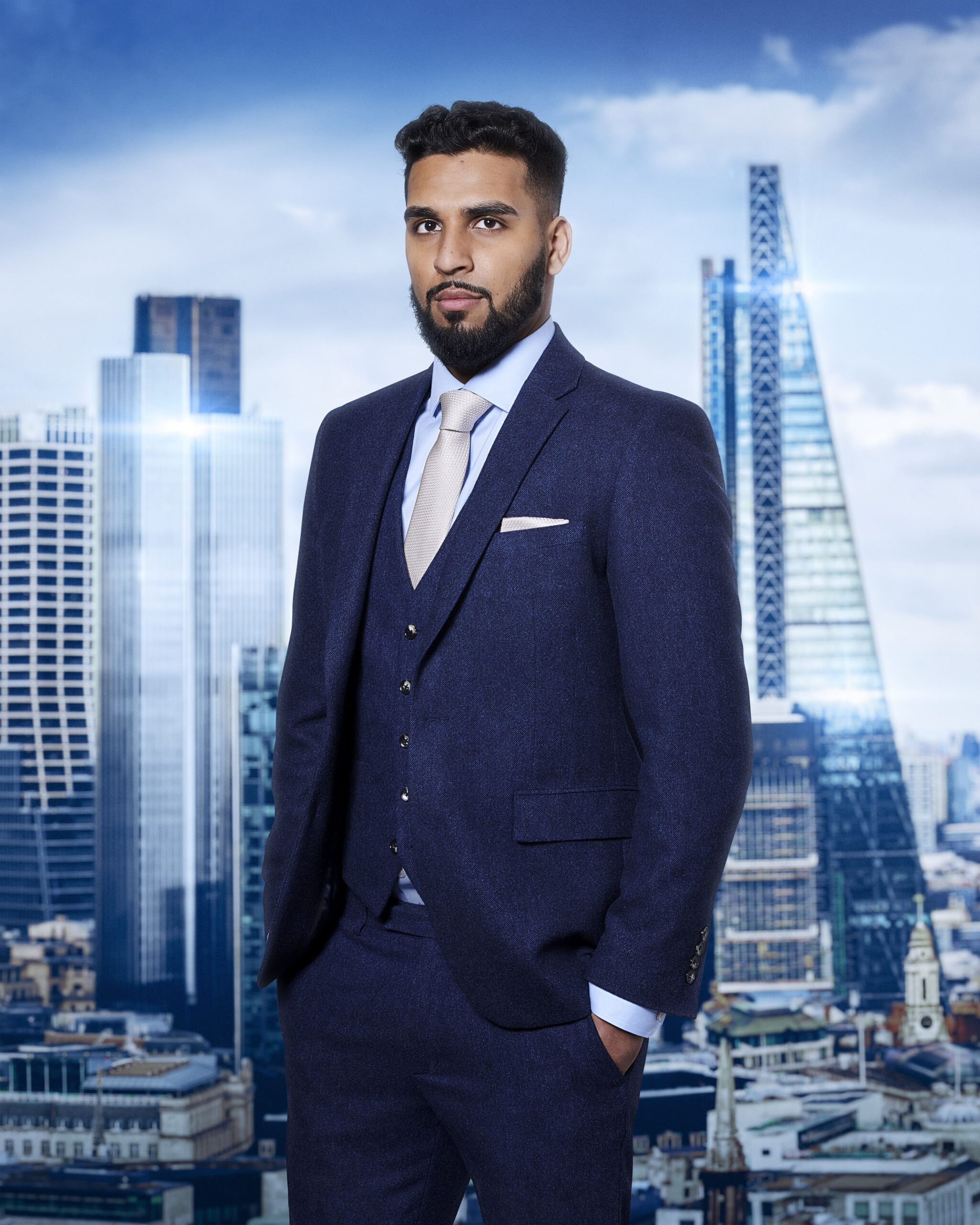 Sohail Chowdhary poses in a suit for The Apprentice