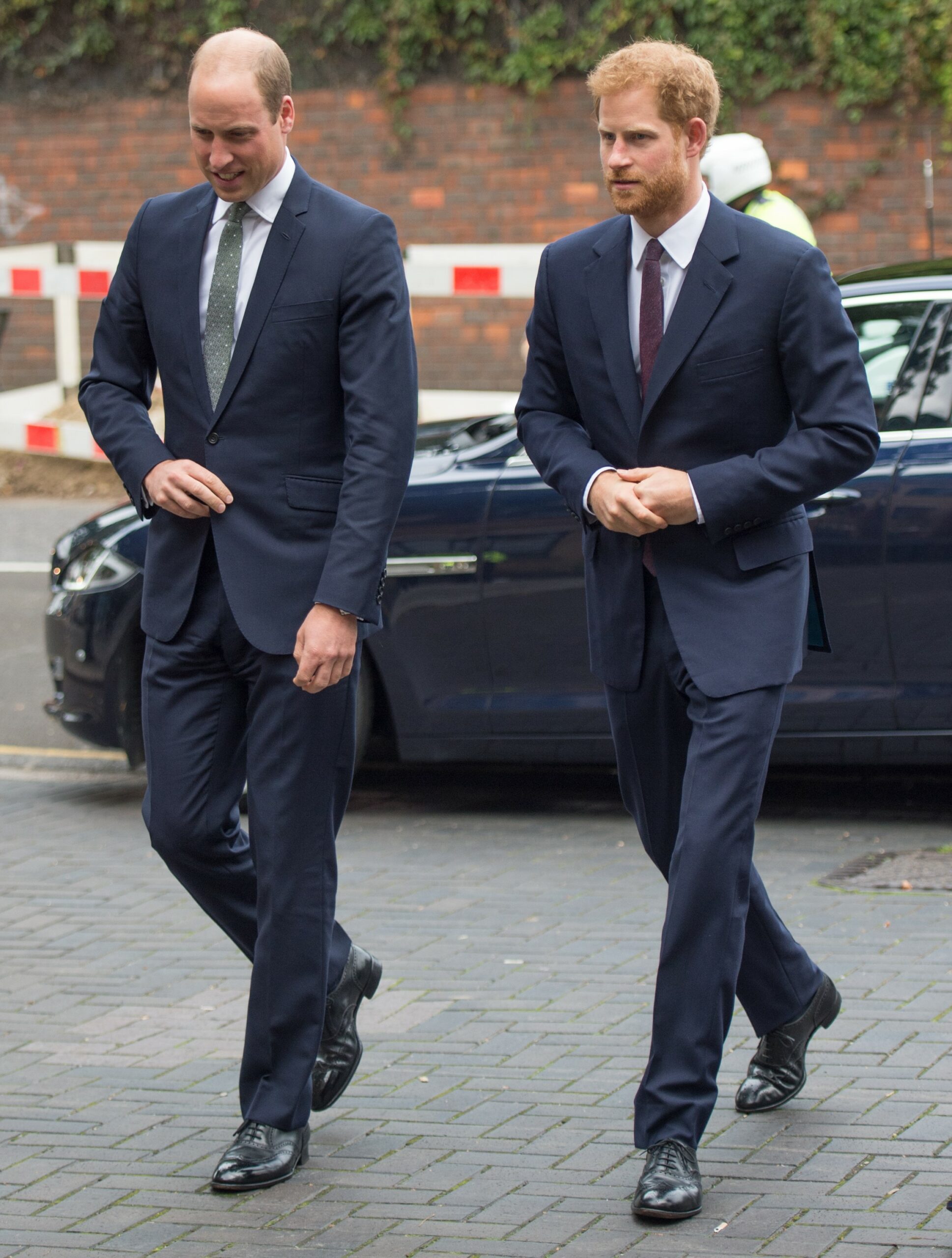 Prince William and Prince Harry walking side by side during engagement