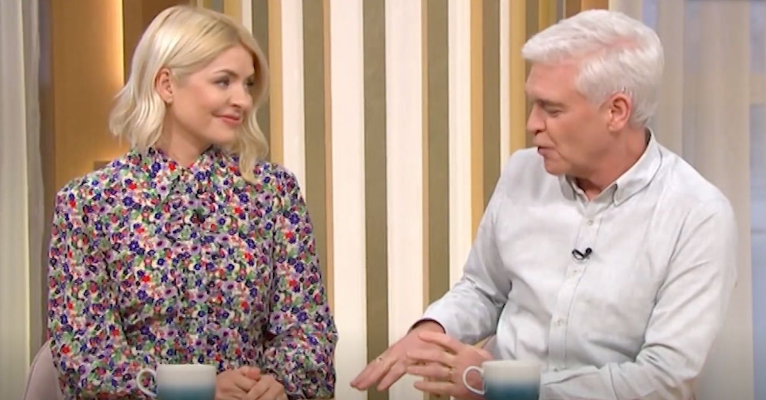 Holly Willoughby, in floral dress today, and Phillip Schofield on This Morning ,