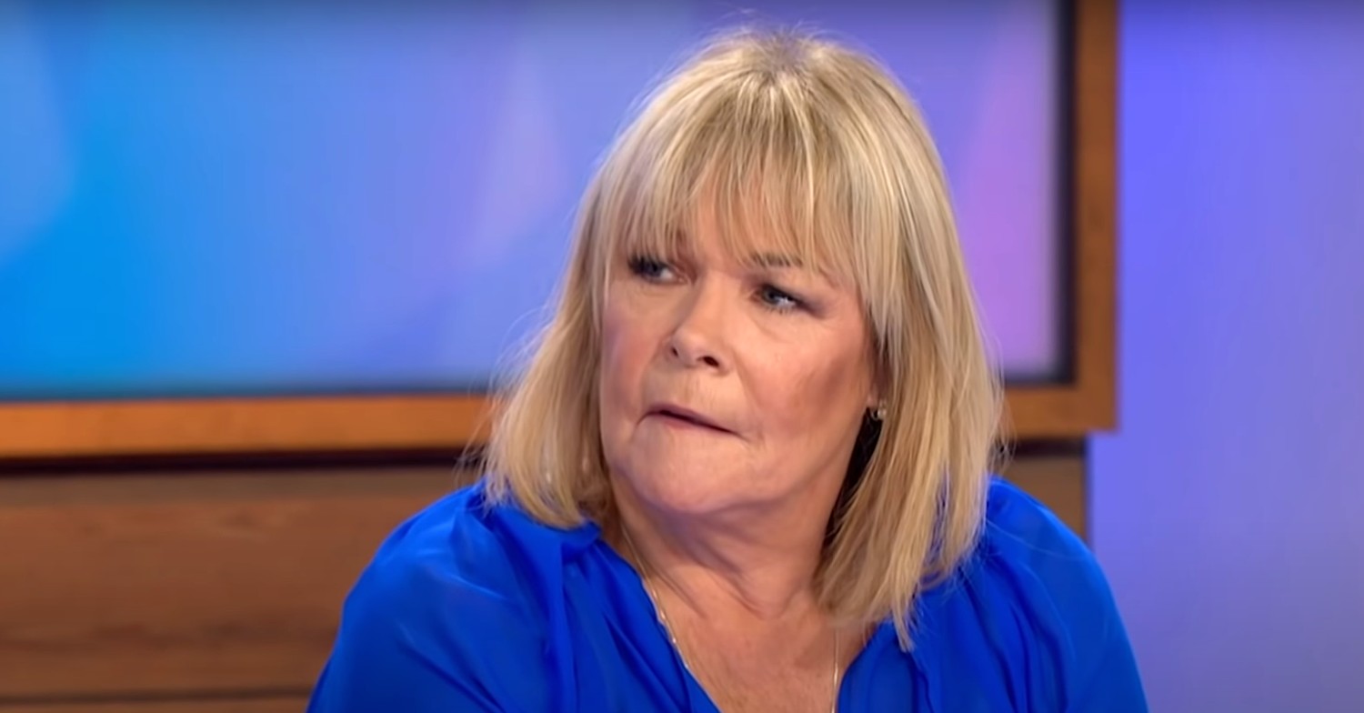 Linda Robson wearing a blue top on Loose Women