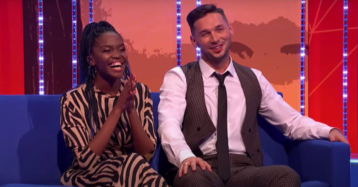 Oti Mabuse claps as she sits next to husband Marius