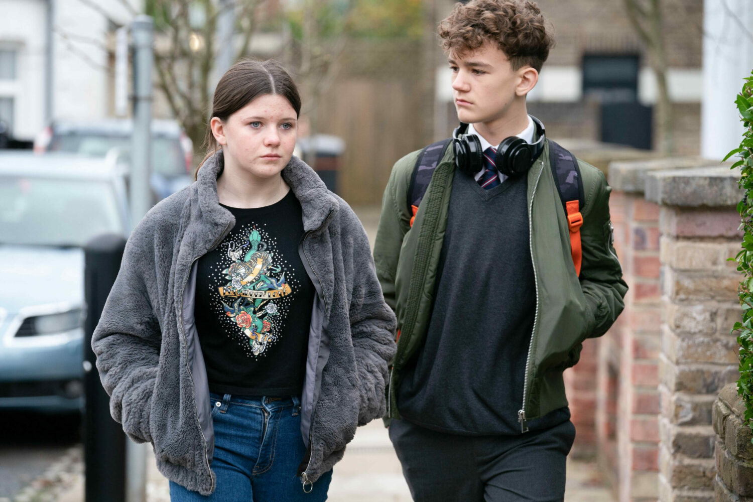 Lily in EastEnders looks upset as she walks with an anxious Ricky Jr.