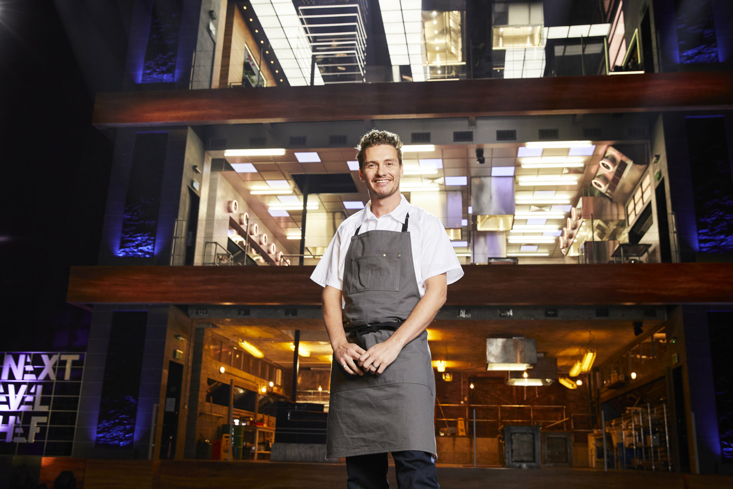 Tony Maloy smiles in the kitchen on Next Level Chef