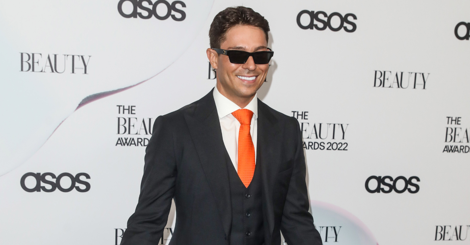 Joey Essex wears sunglasses and poses for photos