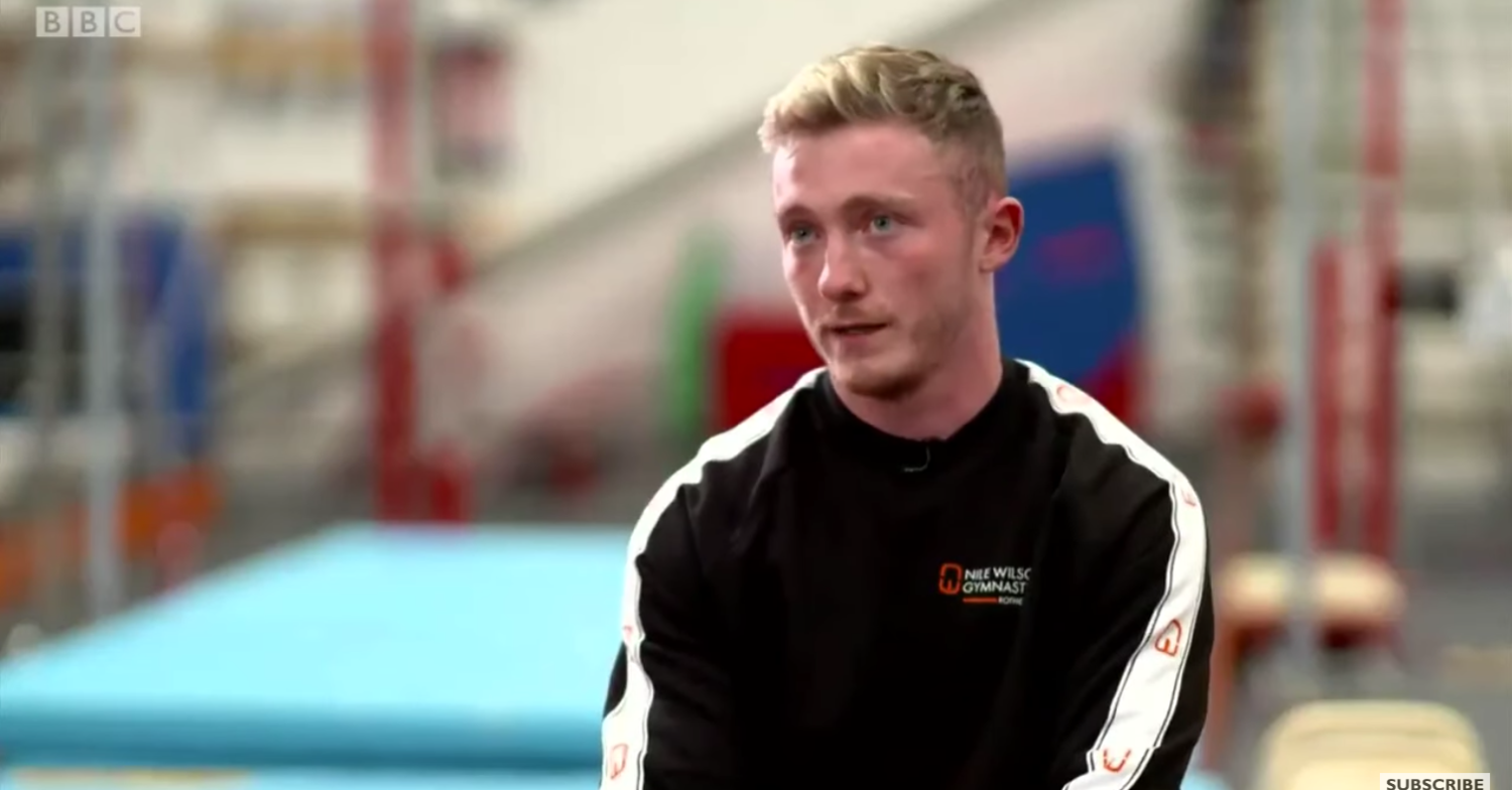 Nile Wilson being interviewed in the gym looking red and upset