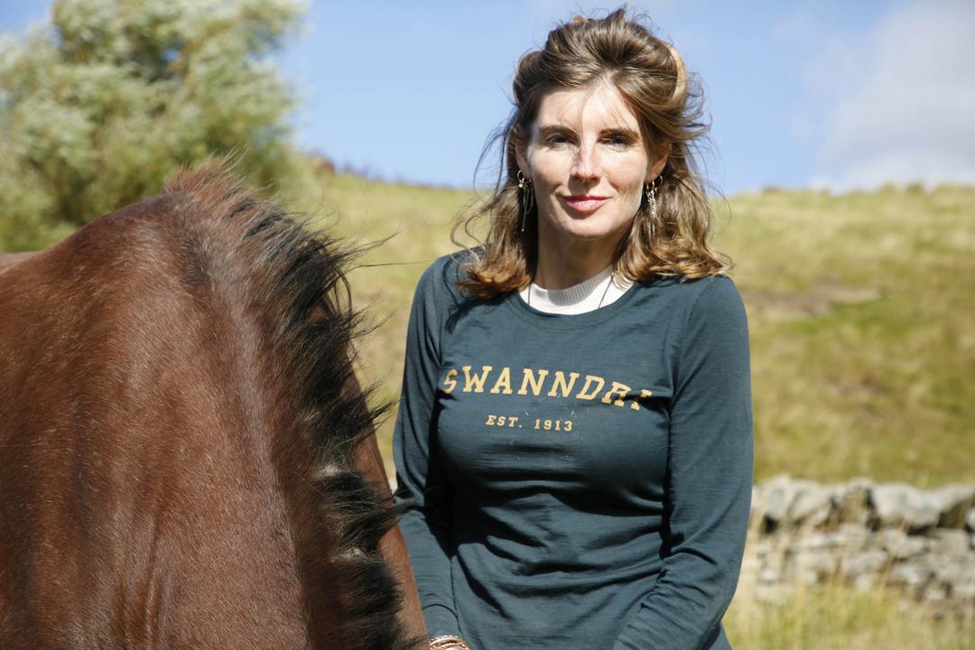 Amanda Owen smiles next to a horse on Our Yorkshire Farm