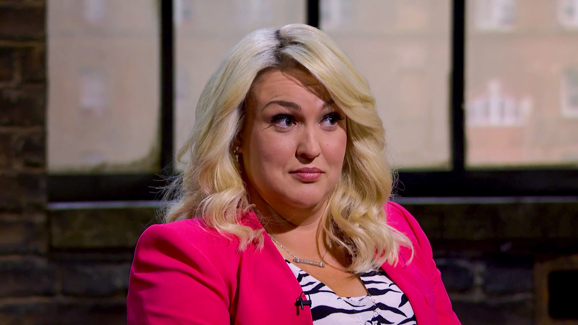 Sara Davies smirking on Dragons' Den