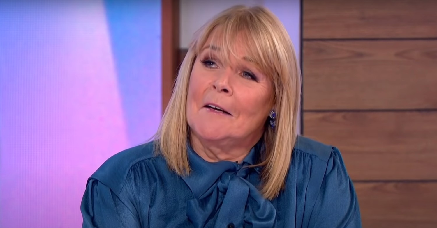 Linda Robson wearing a blue blouse on Loose Women