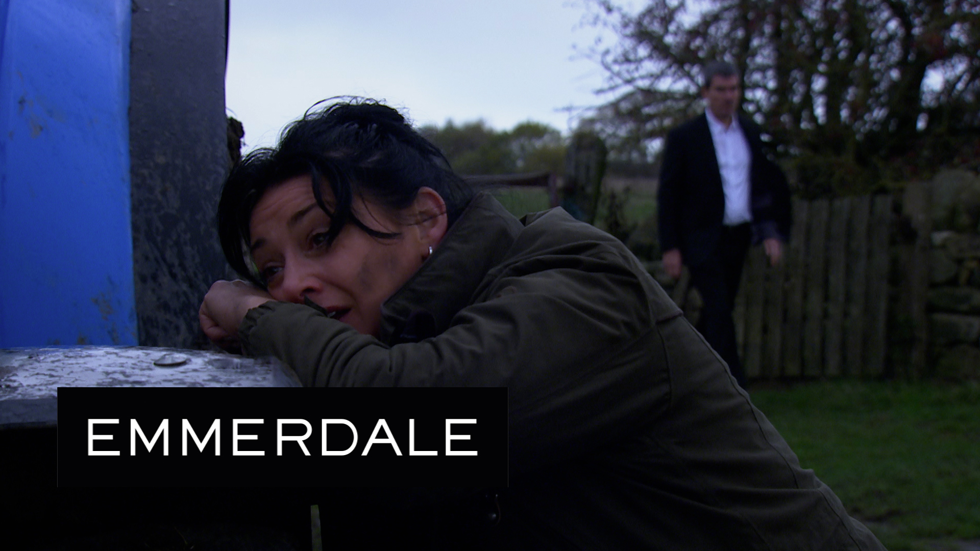 Moira Dingle sobs distraught as Cain strides in in the background