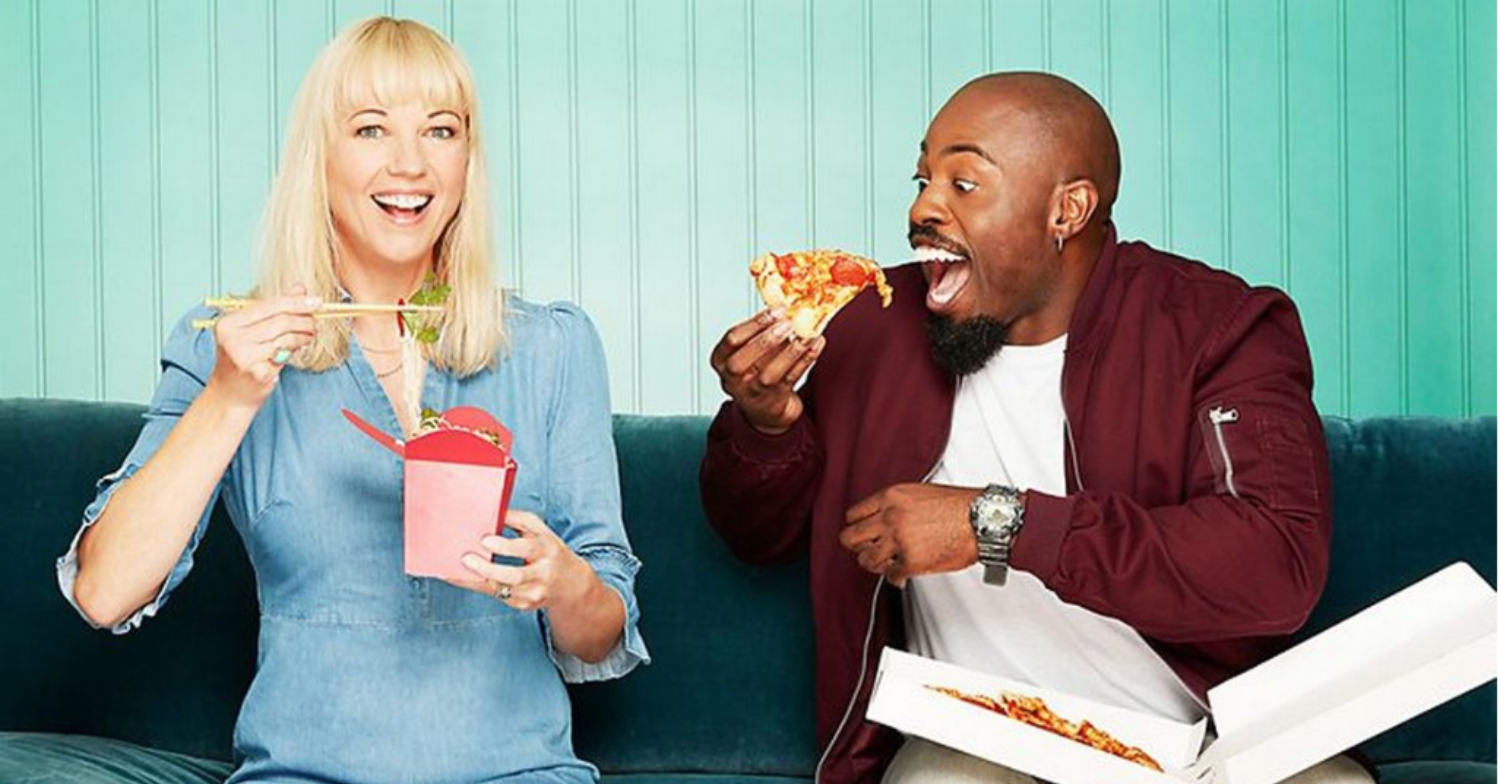 Press shot showing Sara Cox and Darren eating fast food