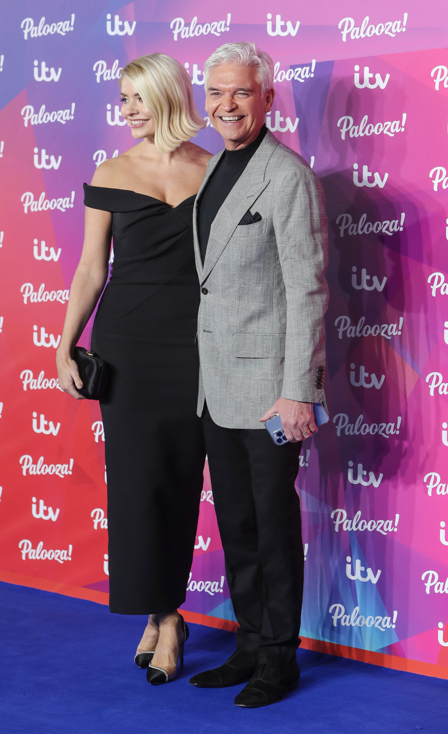 Holly Willoughby and Phillip Schofield smiling on the red carpet