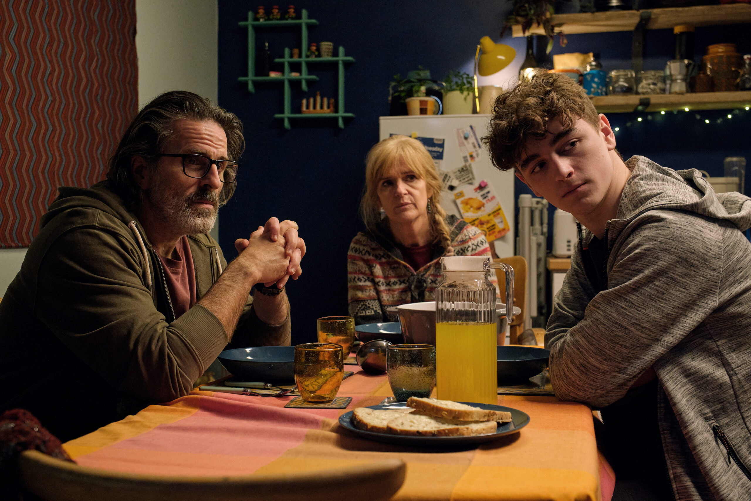 Neil, Clare and Ryan sit around a table in Happy Valley