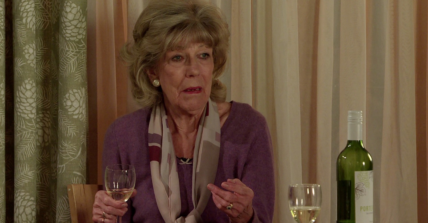 Audrey holding a glass of wine in Coronation Street