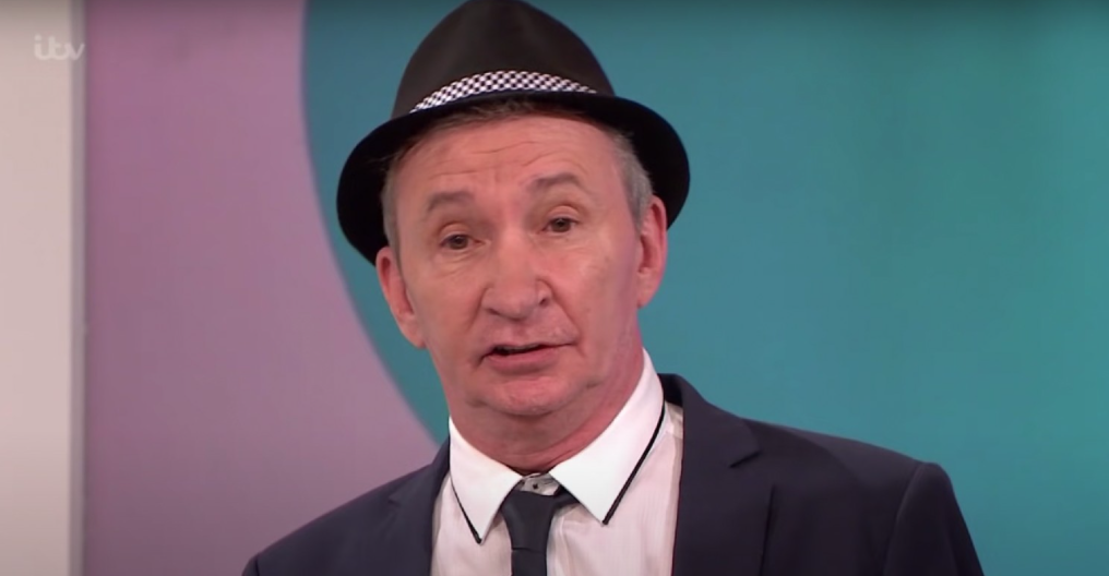 Only Fools and Horses star Patrick Murray being interviewed in a hat