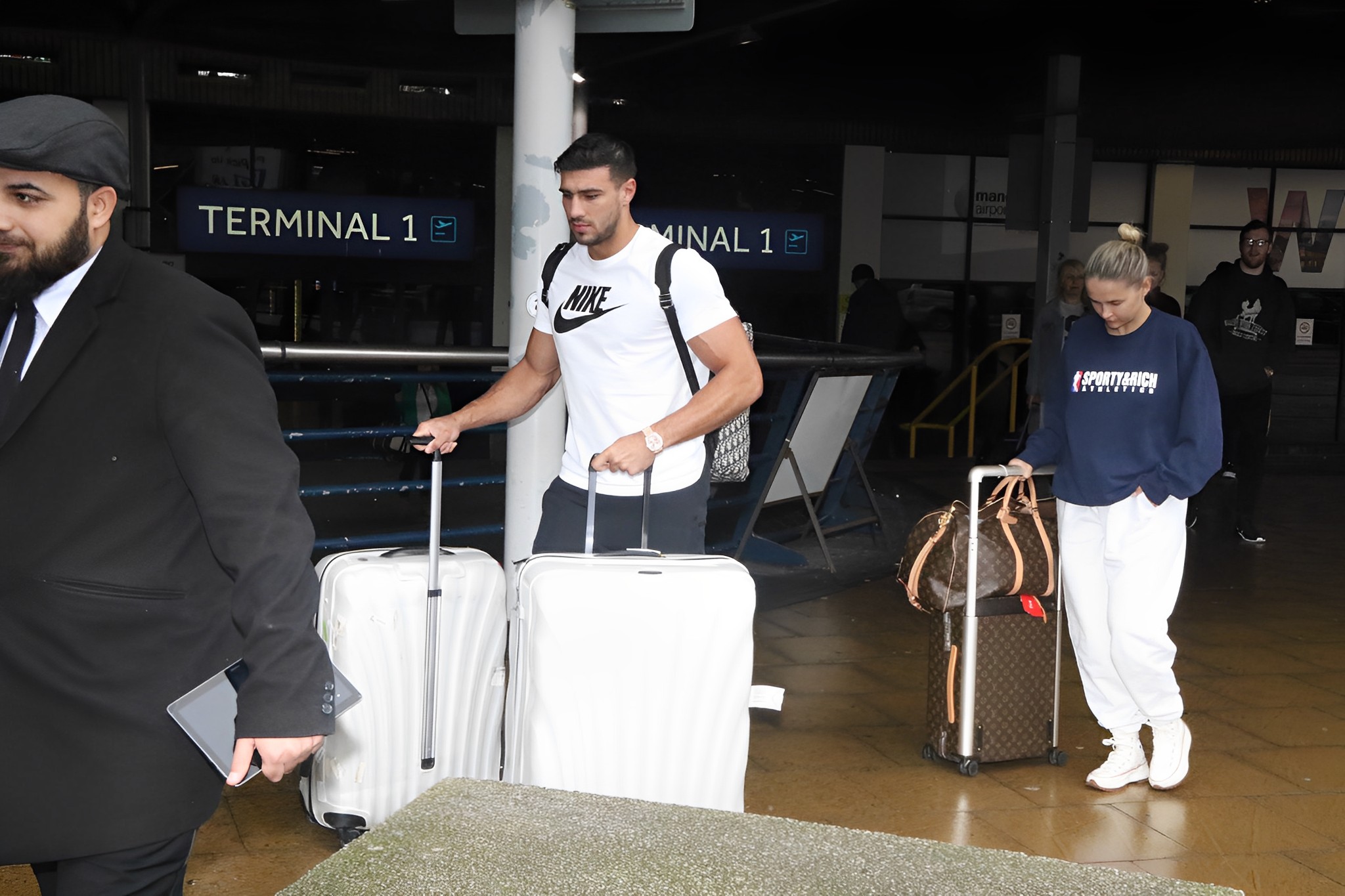 Molly-Mae And Tommy Fury Land Back At Manchester Airport After Their Babymoon To Dubai