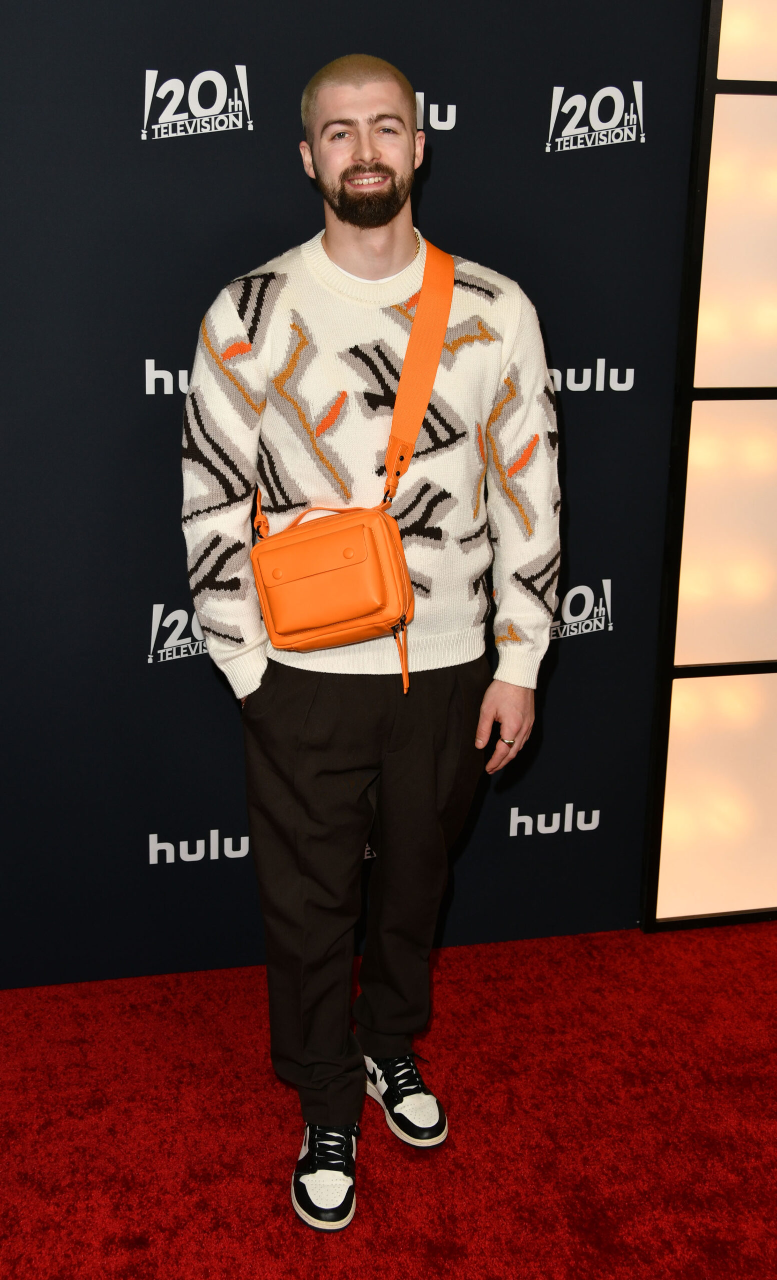 Tom Malone Jr smiles at Welcome To Chippendales premiere in Los Angeles