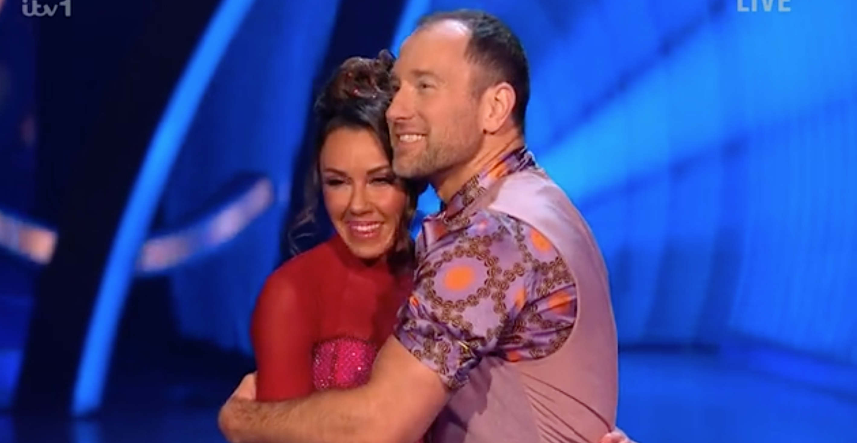 Michelle Heaton and Lukasz Rozycki hug on Dancing On Ice