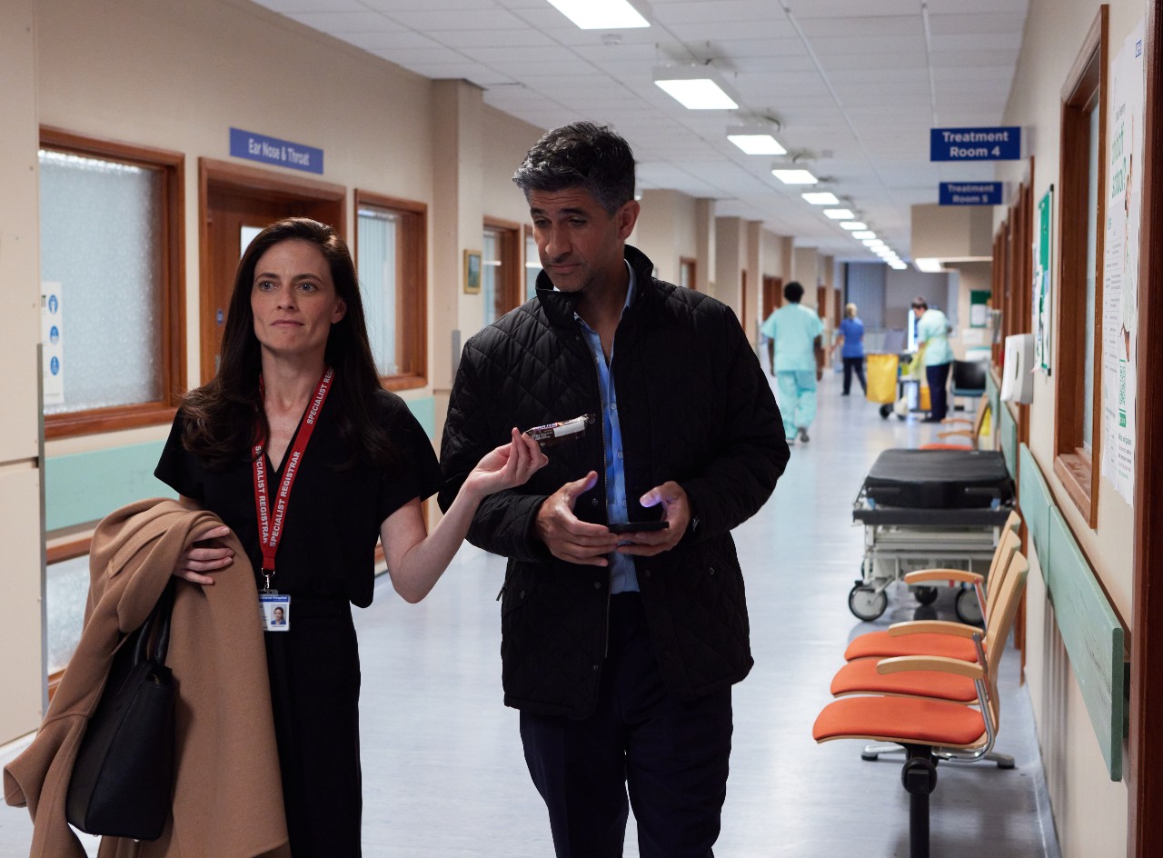 Dr Catherine MacDiarmid hands Dr Jack Oliveira a chocolate bar in Maternal