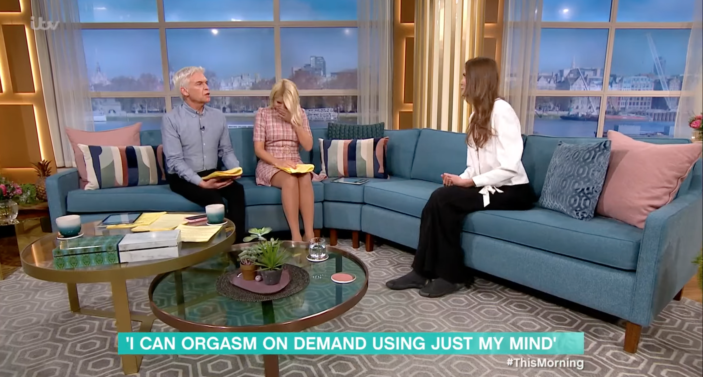 Holly Willoughby giggles alongside Phil and guest on This Morning today