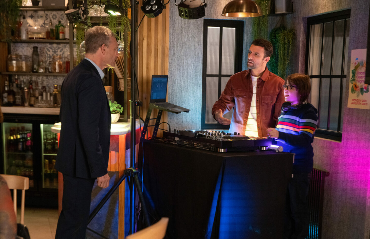 Nick looks concerned as Damon and Sam man the DJ equipment at the bistro on Corrie