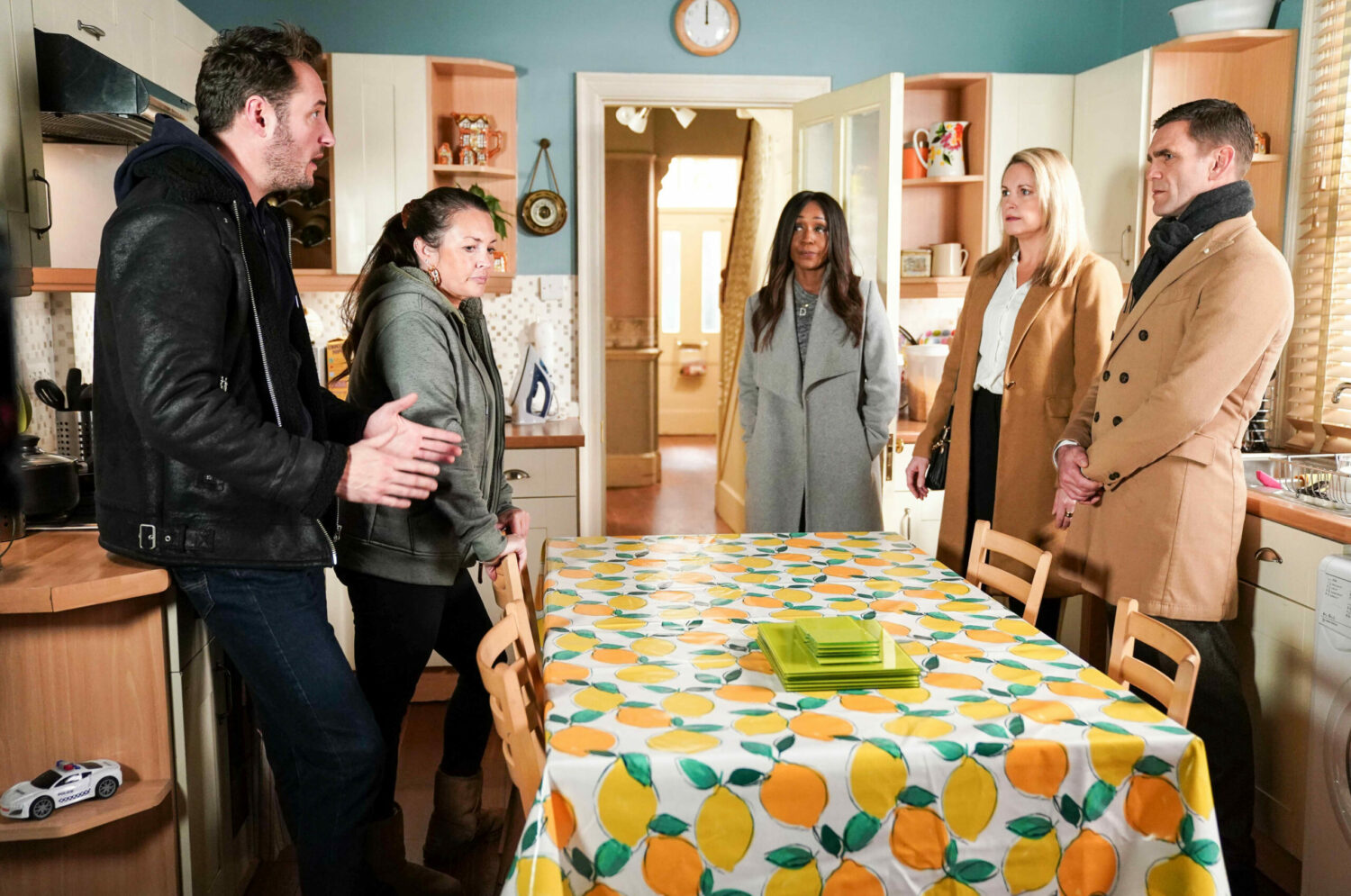 EastEnders' Brannings and Slaters are gathered around a table, rowing
